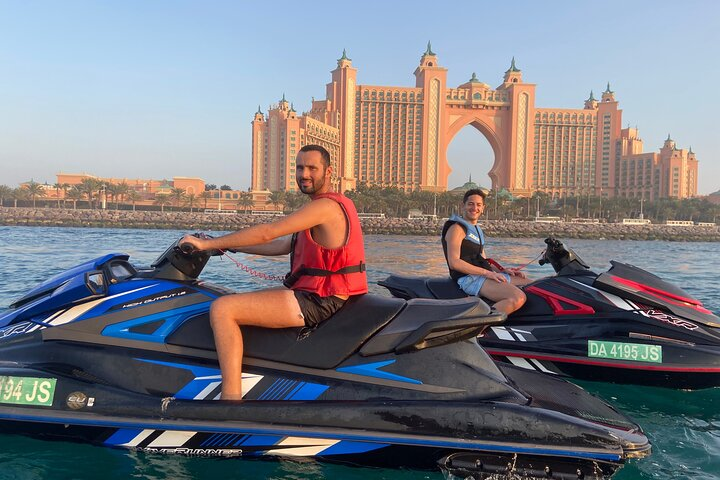 Experience the exhilaration of Jet Skiing in Dubai Marina gliding through crystal-clear waters with iconic views of Atlantis in the background perfect for adventurers and water sport enthusiasts.